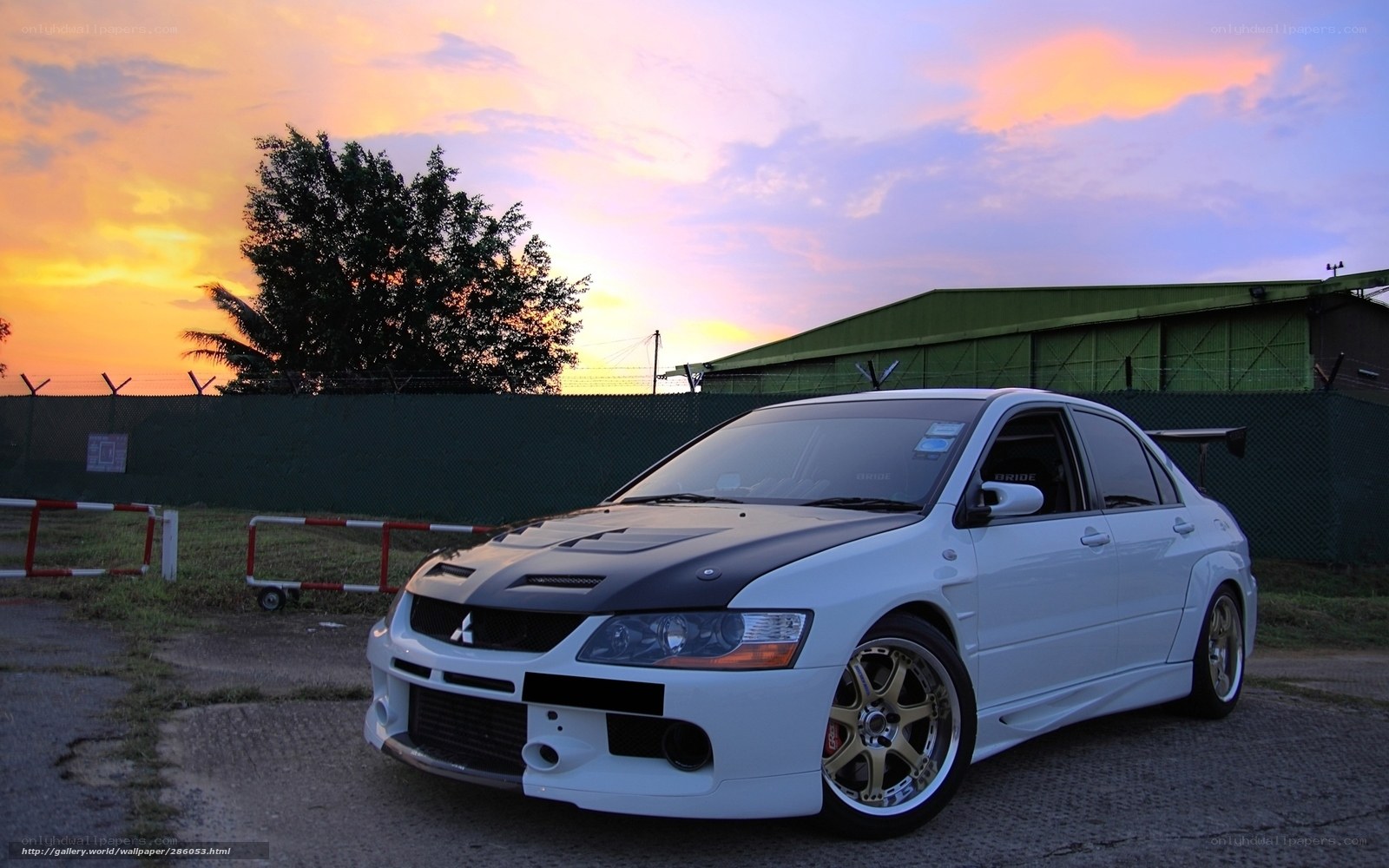 White Mitsubishi Lancer Evolution at sunset