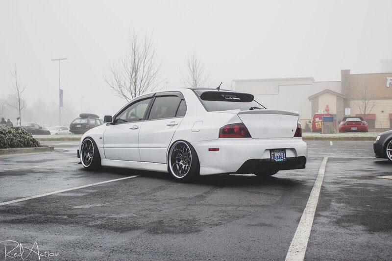 white mitsubishi lancer in parking lot