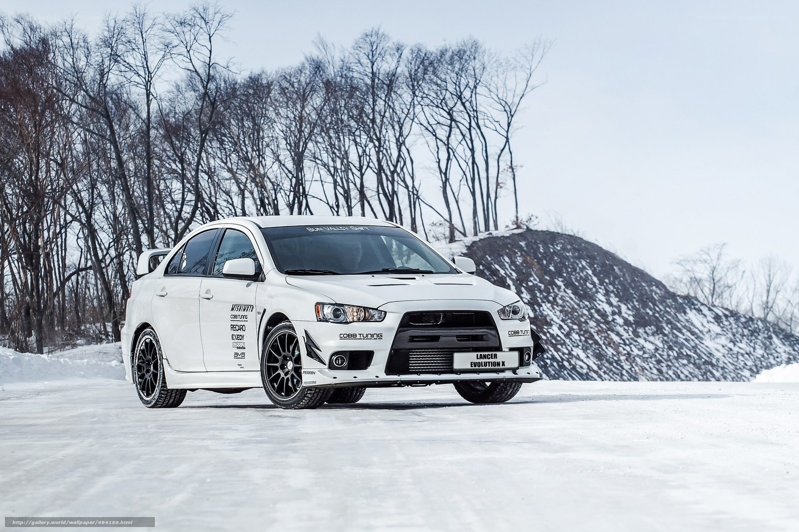 White Mitsubishi Lancer in snow