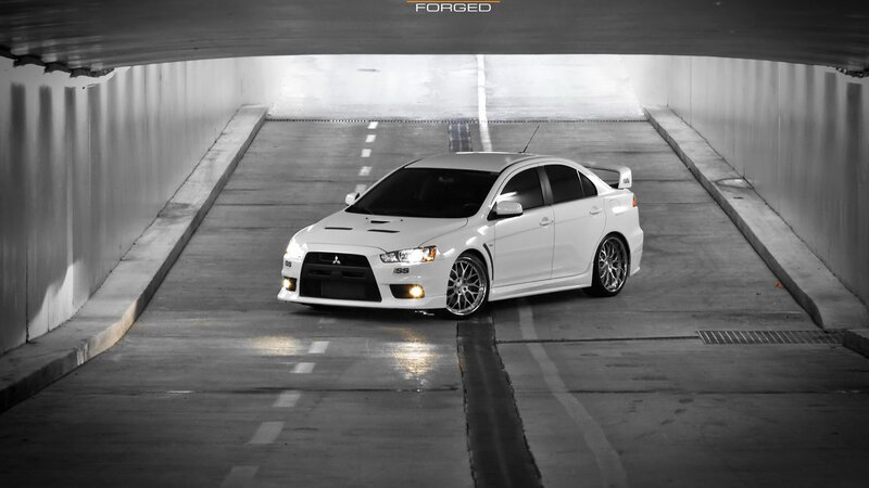 White Mitsubishi Lancer in tunnel
