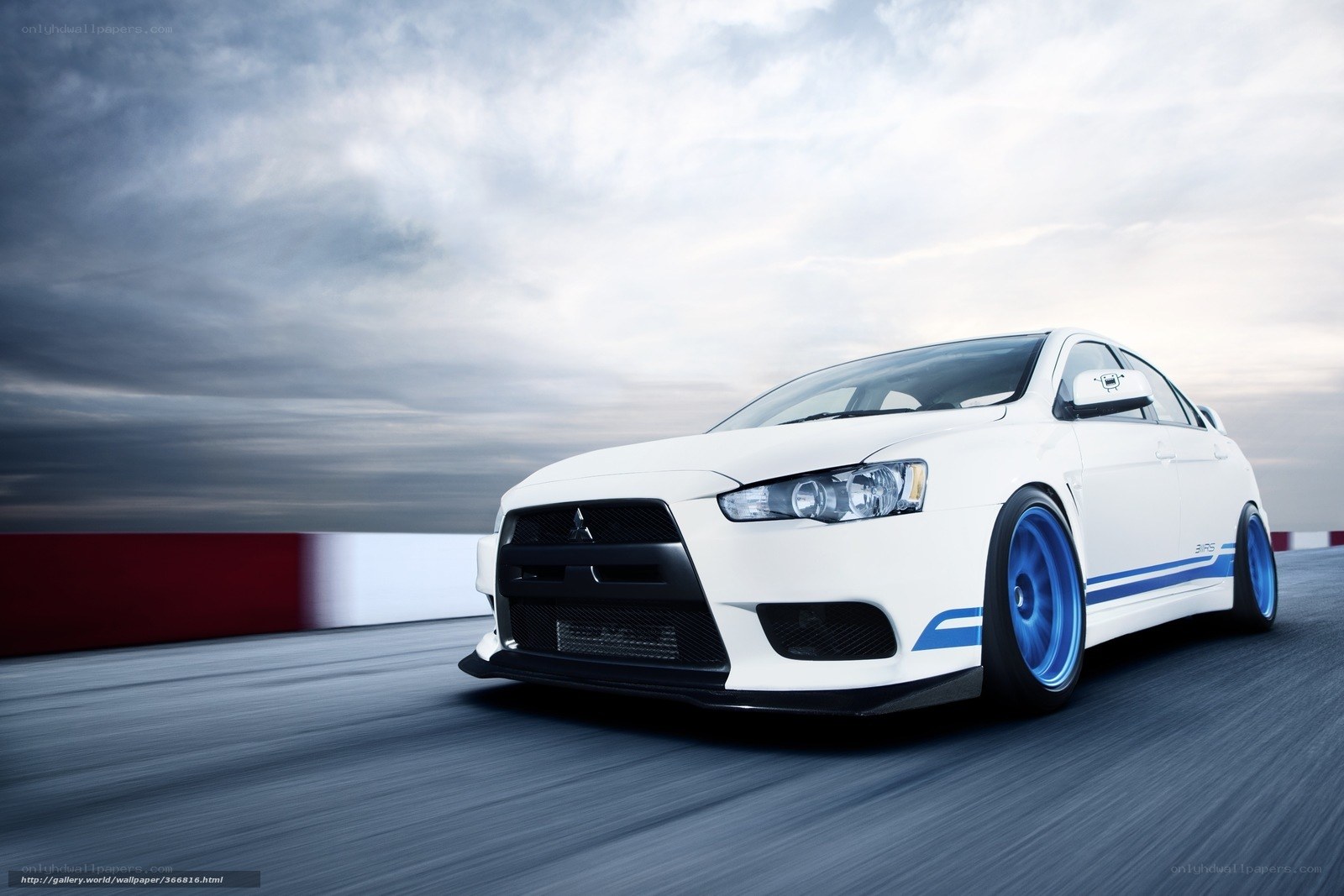 White Mitsubishi on racetrack