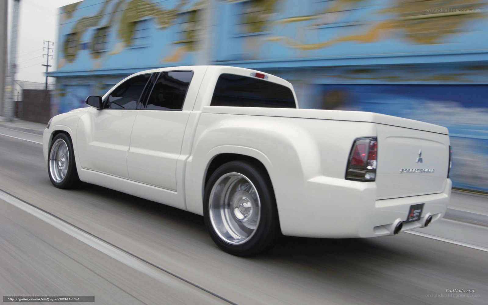 white mitsubishi pickup truck