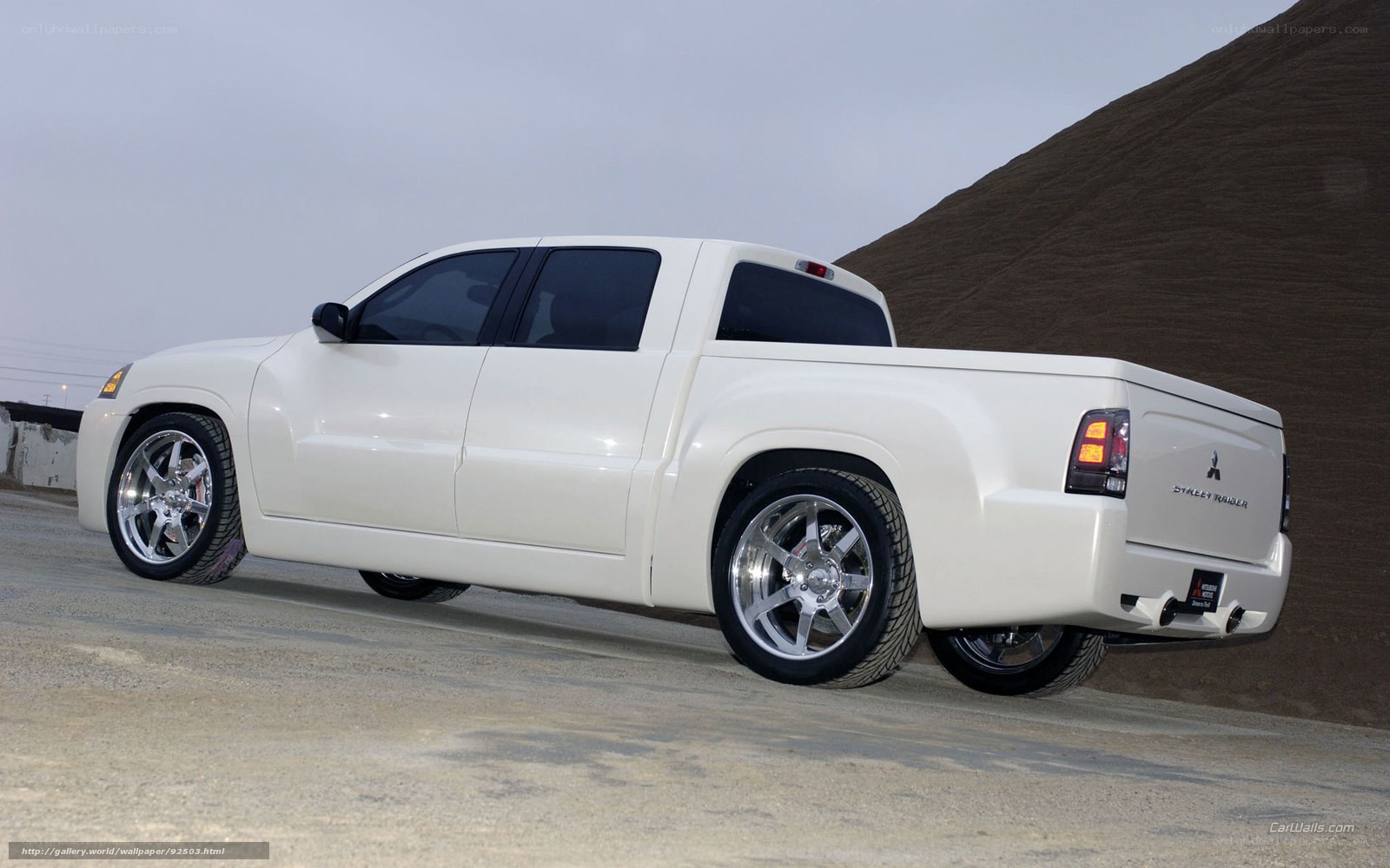 white mitsubishi pickup truck