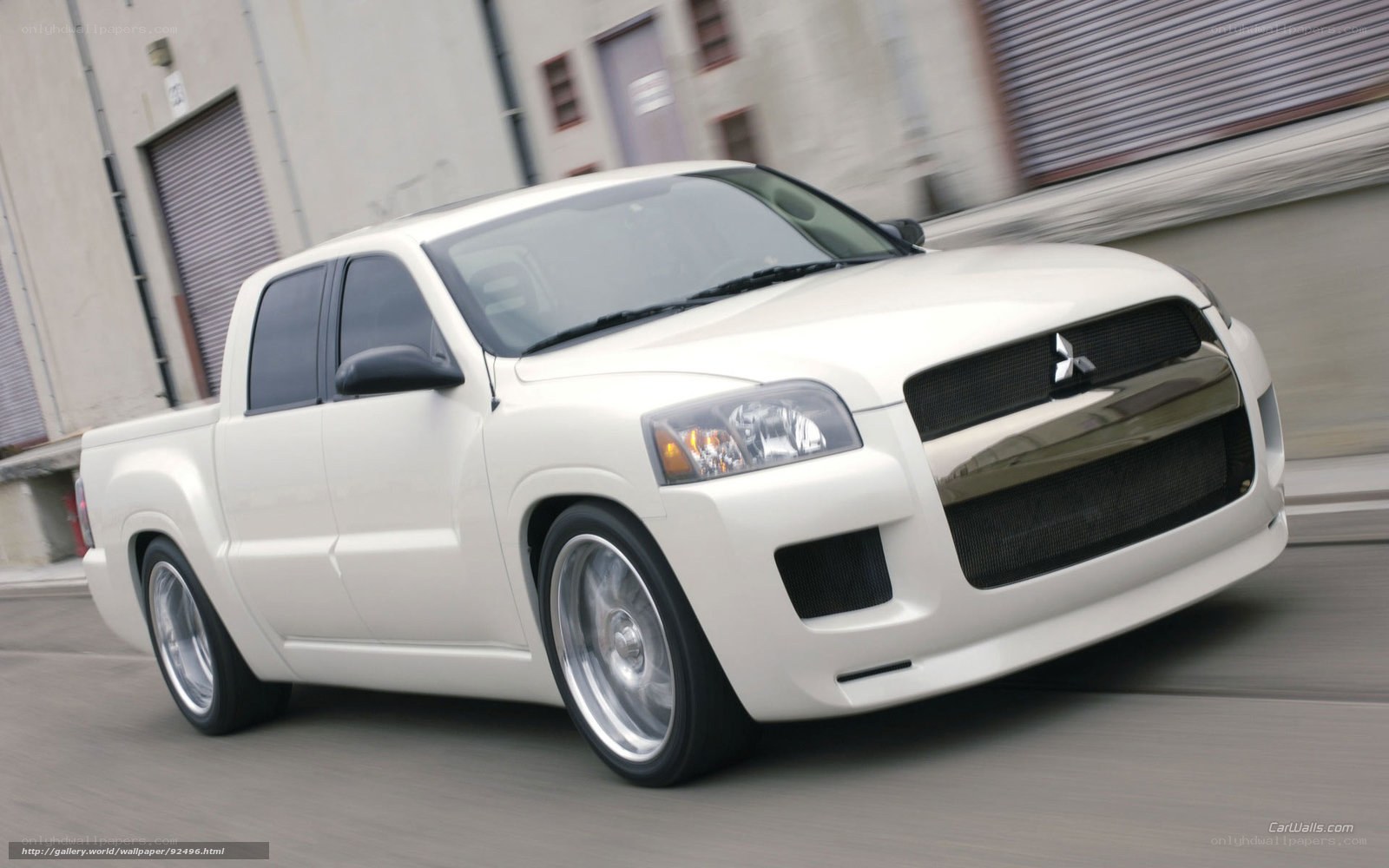 white mitsubishi pickup truck