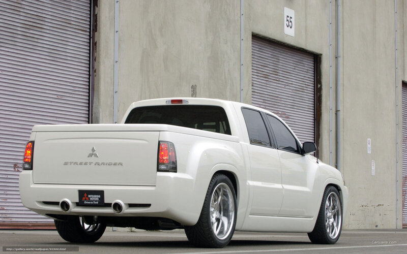 white mitsubishi street raider pickup