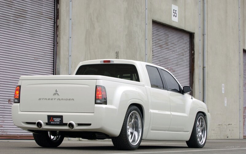 white mitsubishi street raider pickup