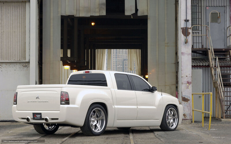 White Mitsubishi Street Raider pickup