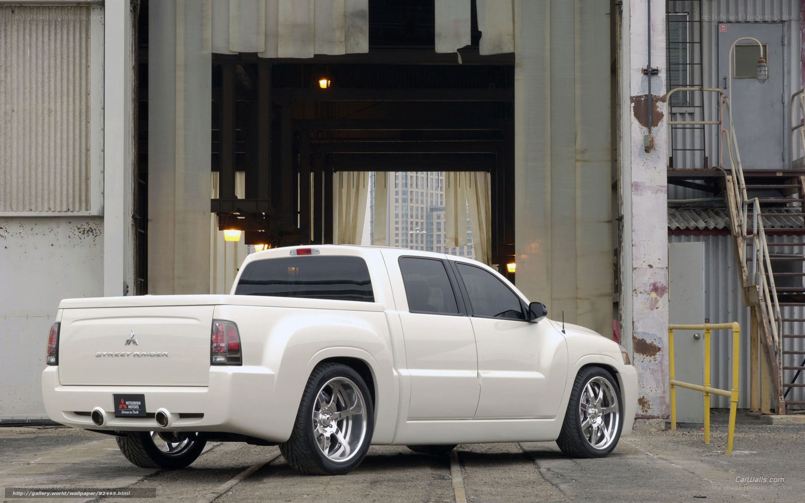 White Mitsubishi Street Raider pickup