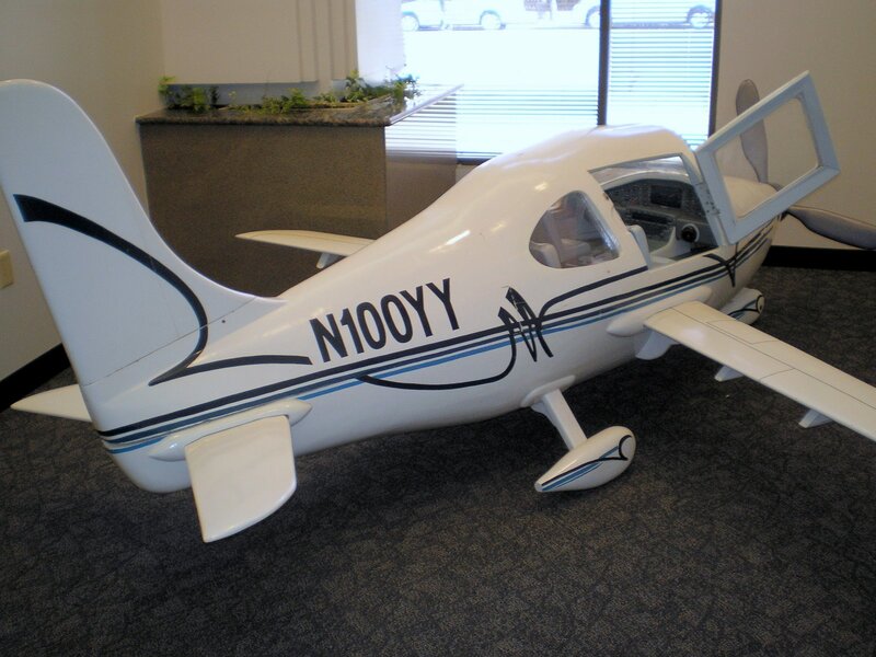 white model airplane in office