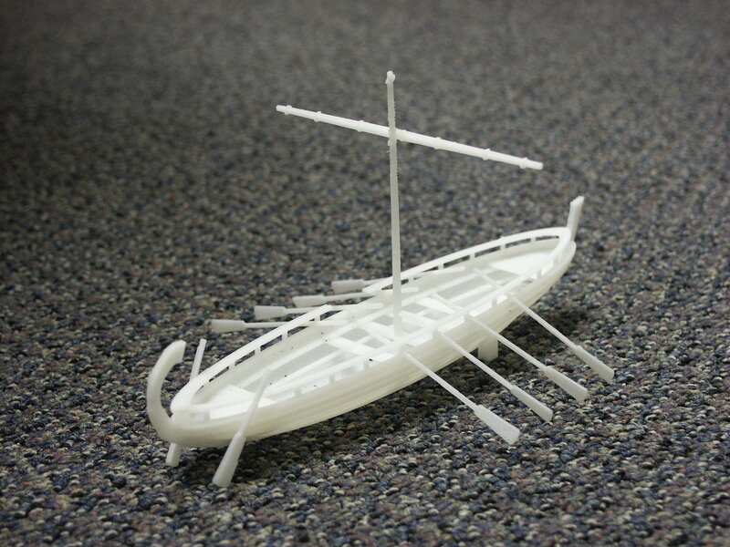 white model ship on carpet
