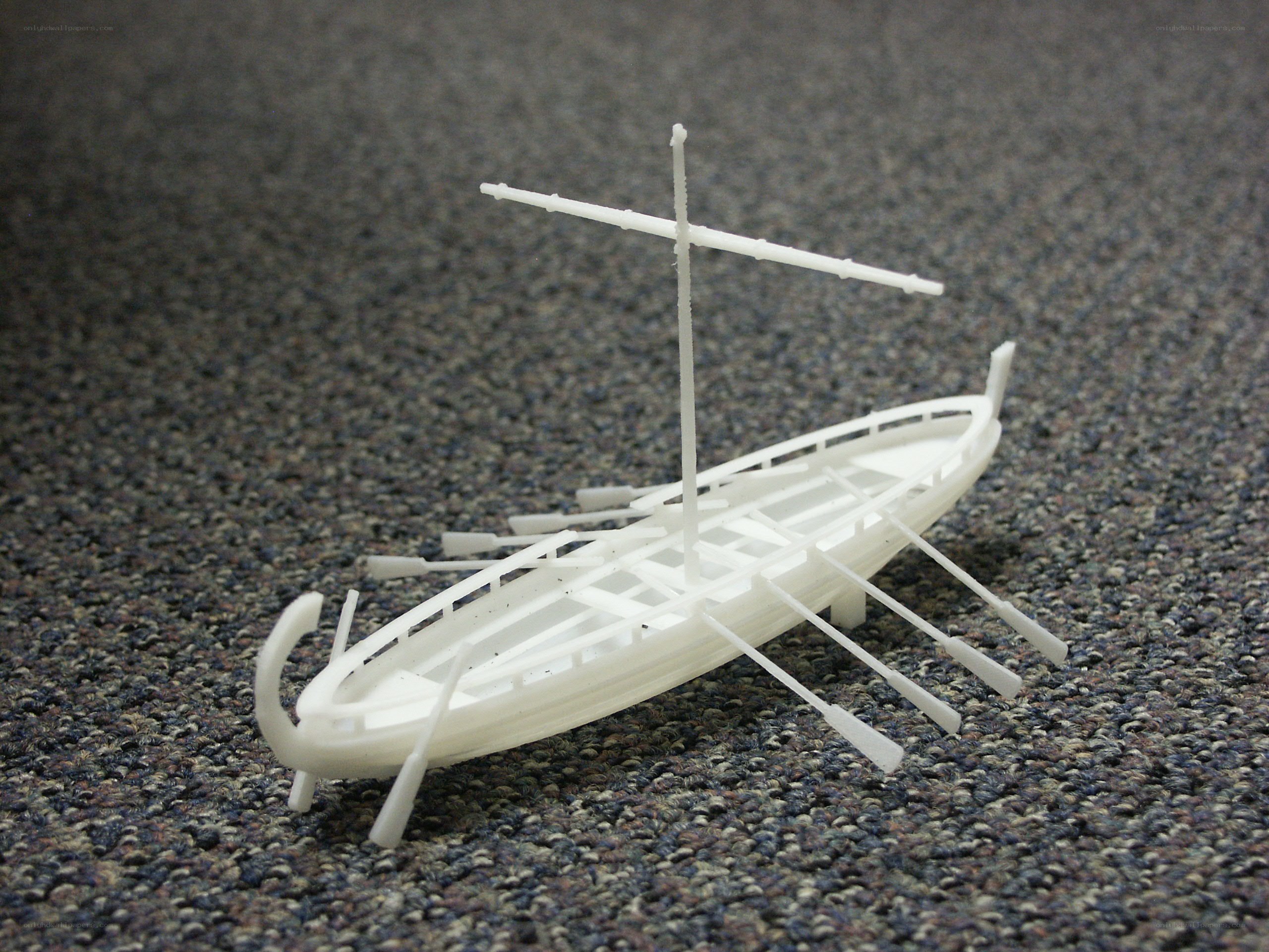 white model ship on carpet