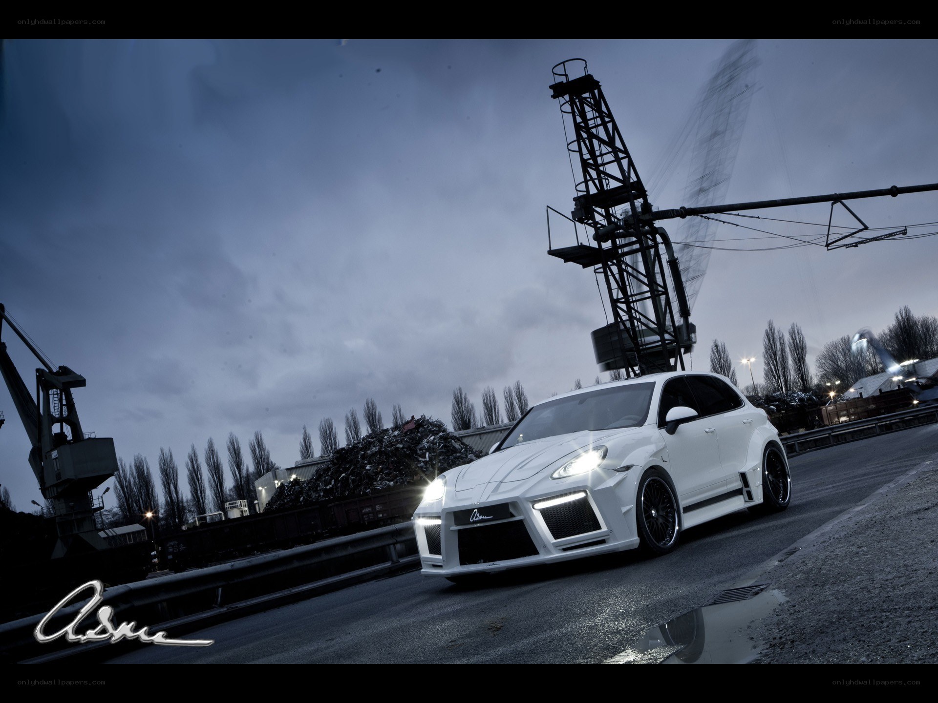 White modified car at industrial site