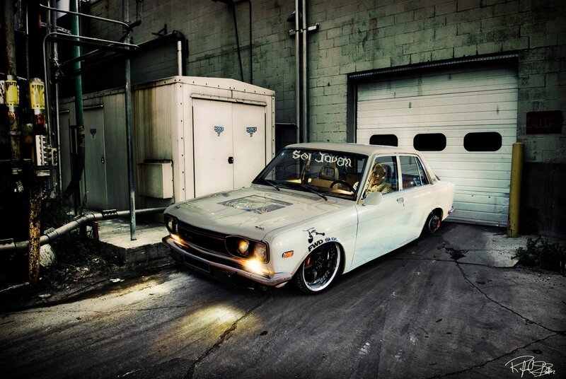 White modified car in alley