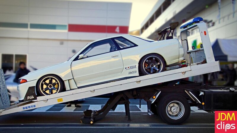 White Modified Car on Tow Truck