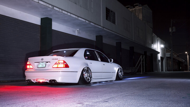White Modified Sedan — Dramatic, Night, Photograph, Building