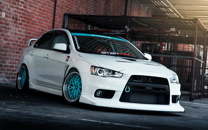 White Modified Sedan — Dramatic, Photograph, Brick Wall
