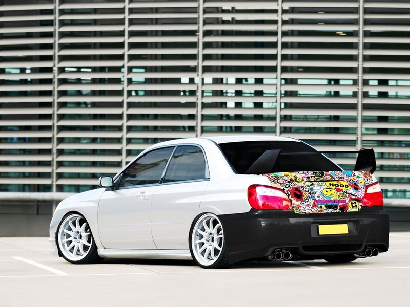 White Modified Sedan — Urban, Afternoon, Photograph, Sticker-covered Trunk