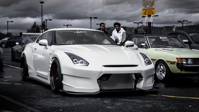 white modified sports car at a meet