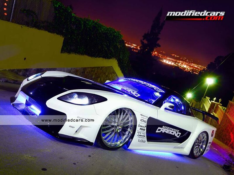 white modified sports car at night