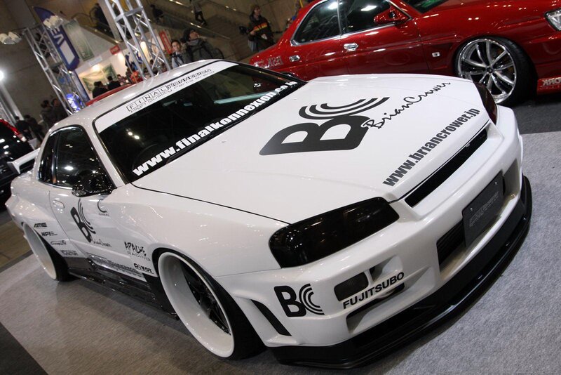white modified sports car at show