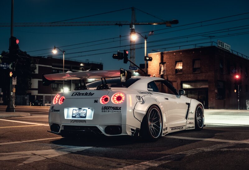 White Modified Sports Car — Dramatic, Night, Photograph, Crane