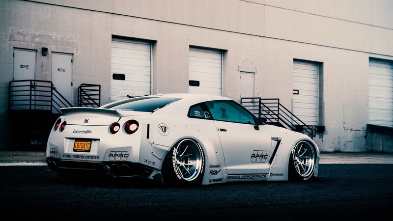 White Modified Sports Car — Dramatic, Photograph, Building, Garage Doors