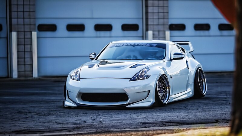 White Modified Sports Car — Dramatic, Photograph, Garage Door
