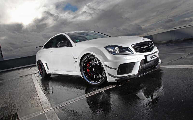 White Modified Sports Car — Dramatic, Photograph, Wet Pavement, Cloudy Sky