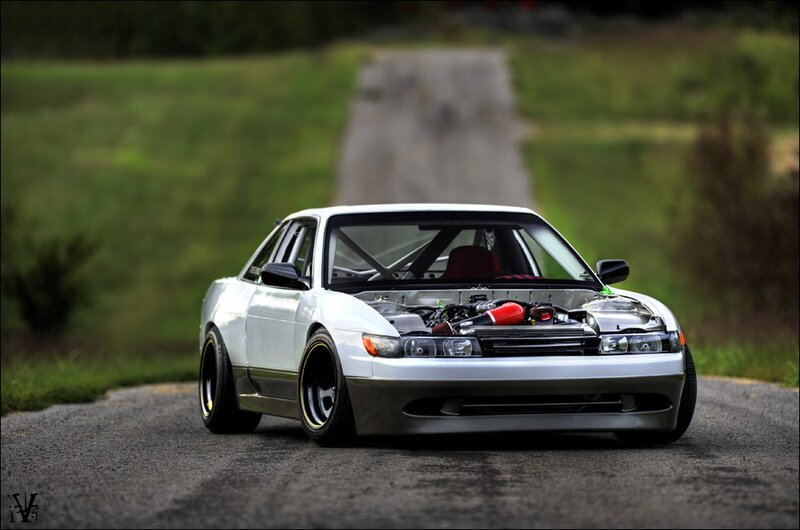 white modified sports car on road