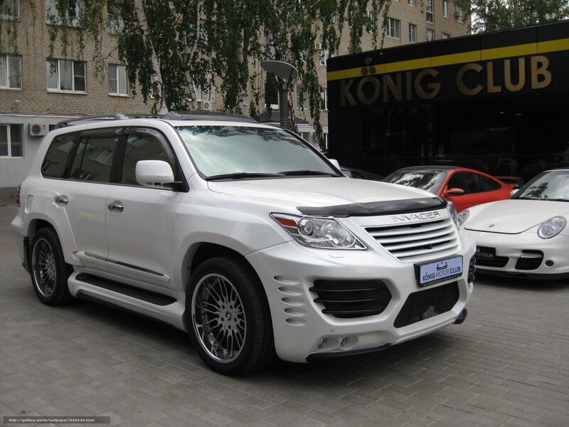 white modified suv in front of club