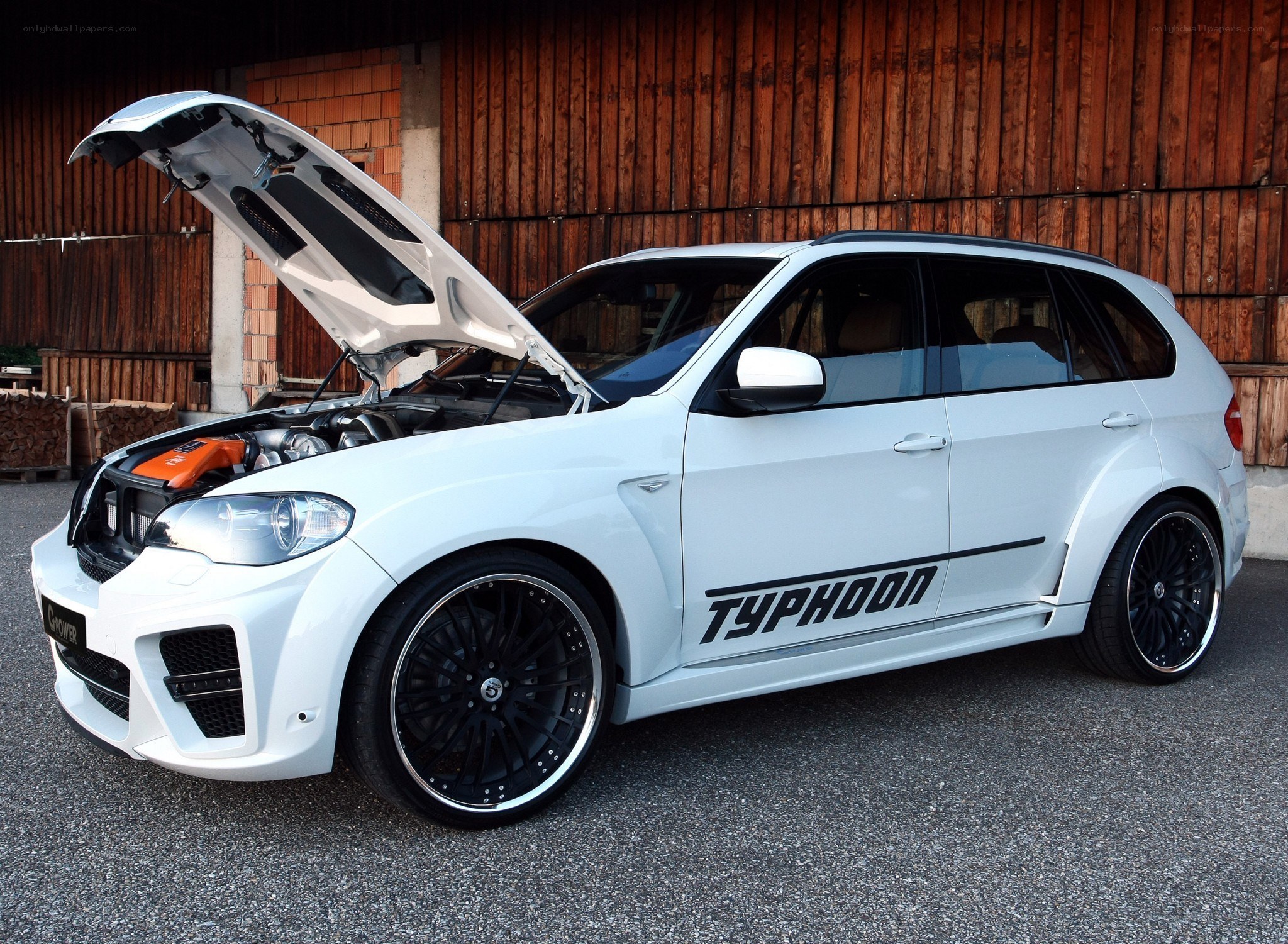 white modified suv with open hood
