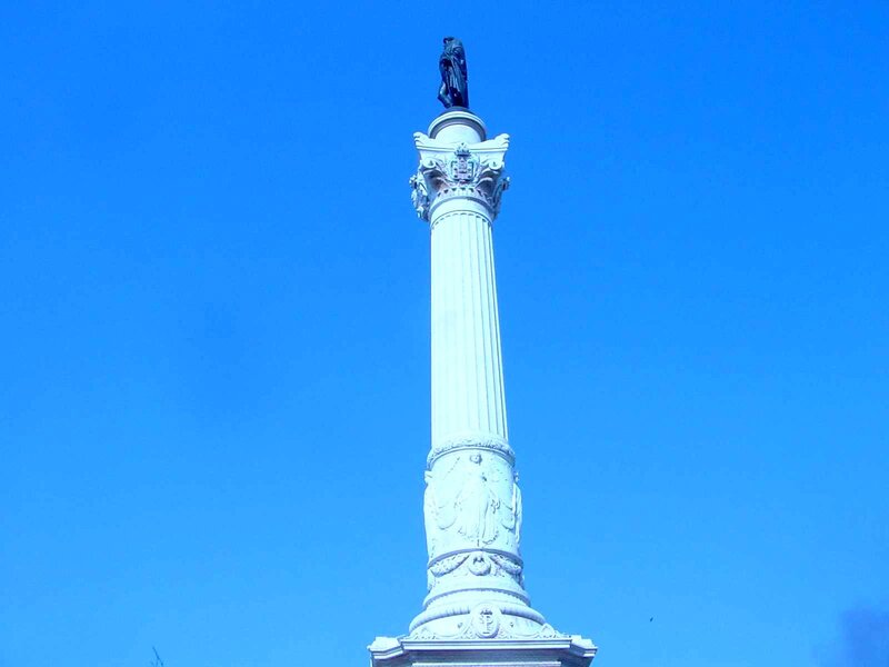 white monument with statue