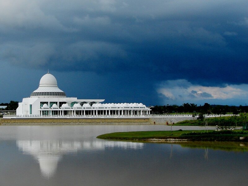 White mosque under stormy sky