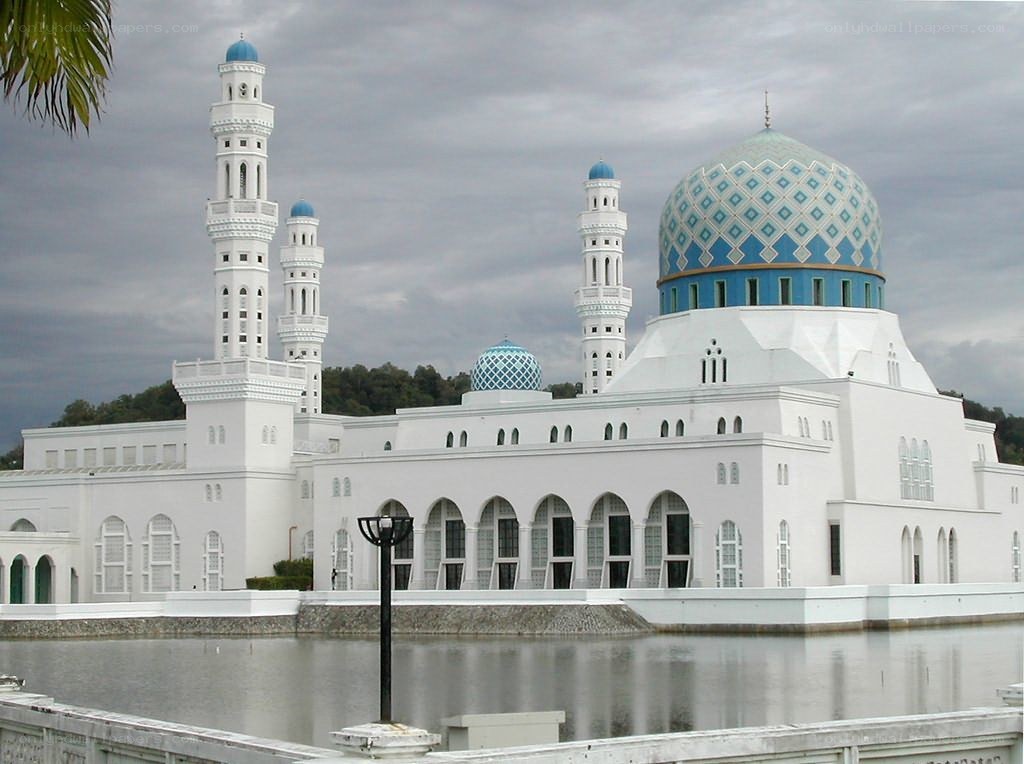 White mosque with blue domes
