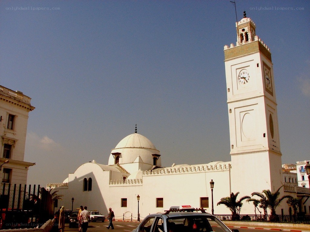 White mosque with clock tower
