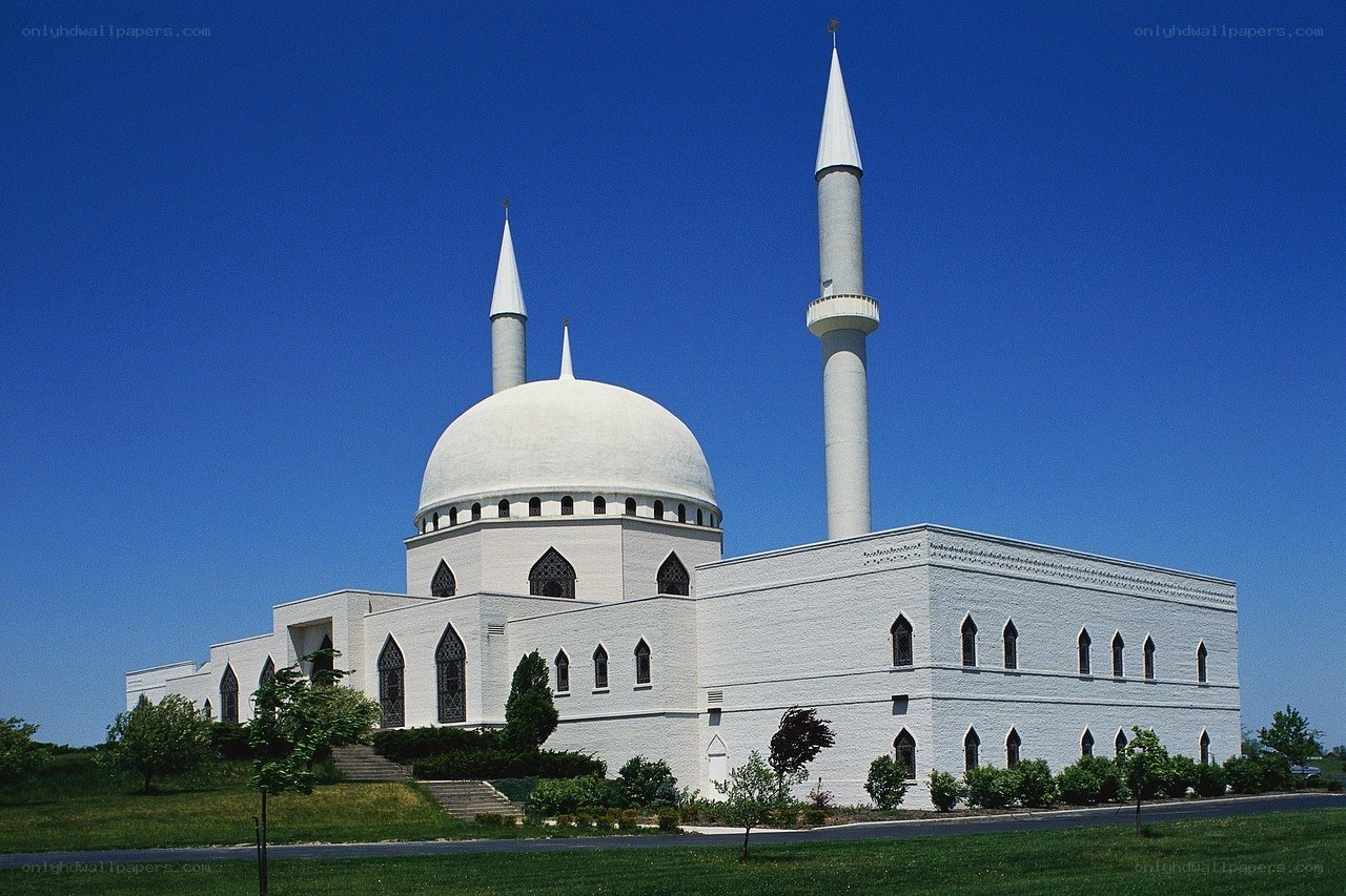 White mosque with domes and minarets