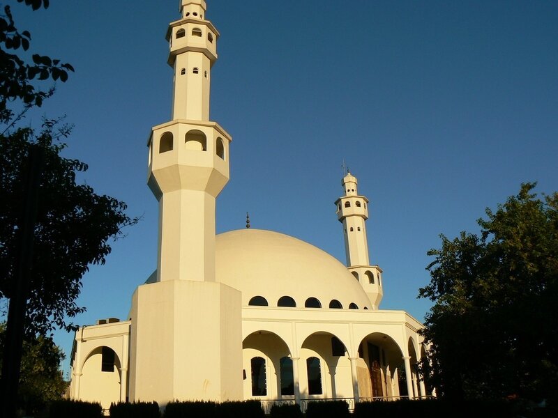 White mosque with domes and minarets