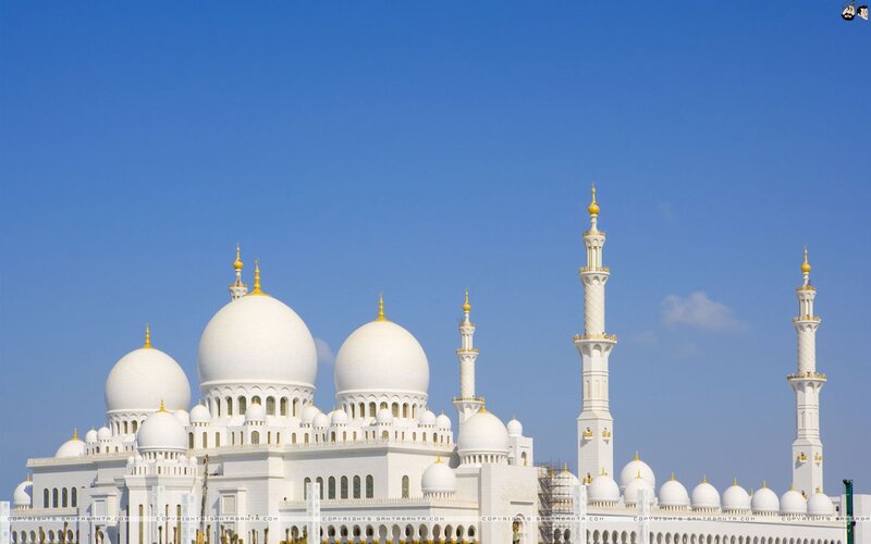 White mosque with domes and minarets