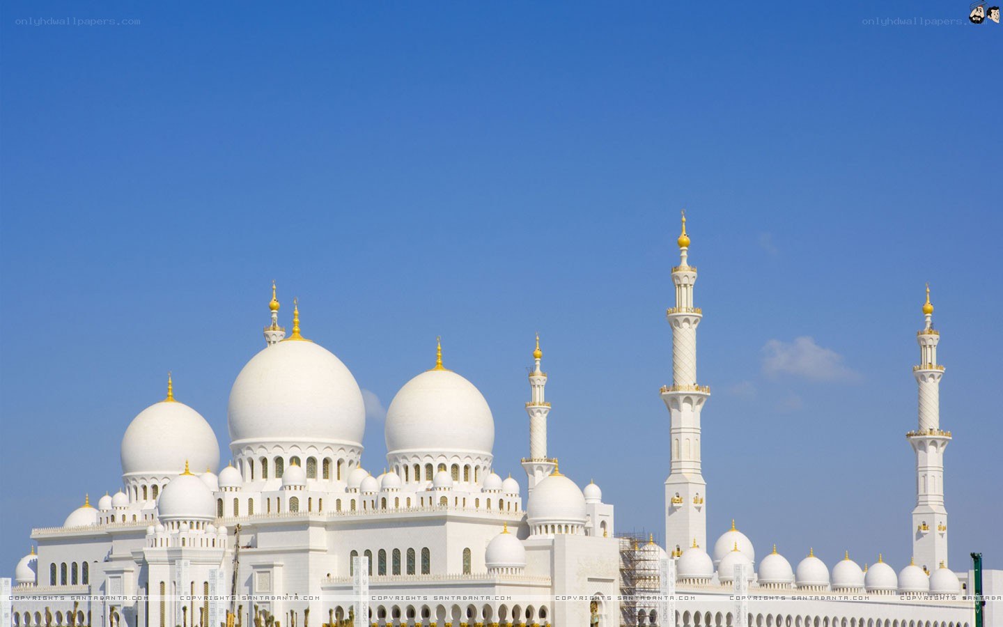 White mosque with domes and minarets