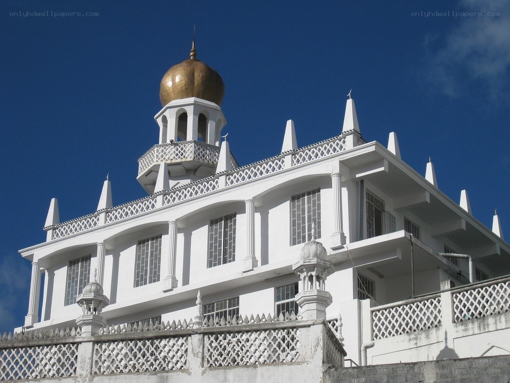 White mosque with golden dome