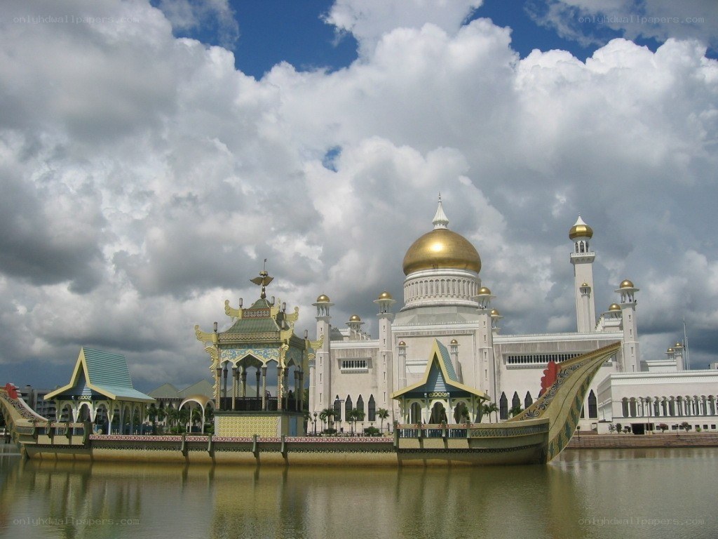 White mosque with golden dome