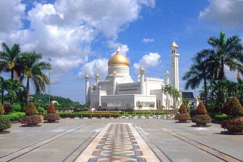 White mosque with golden dome