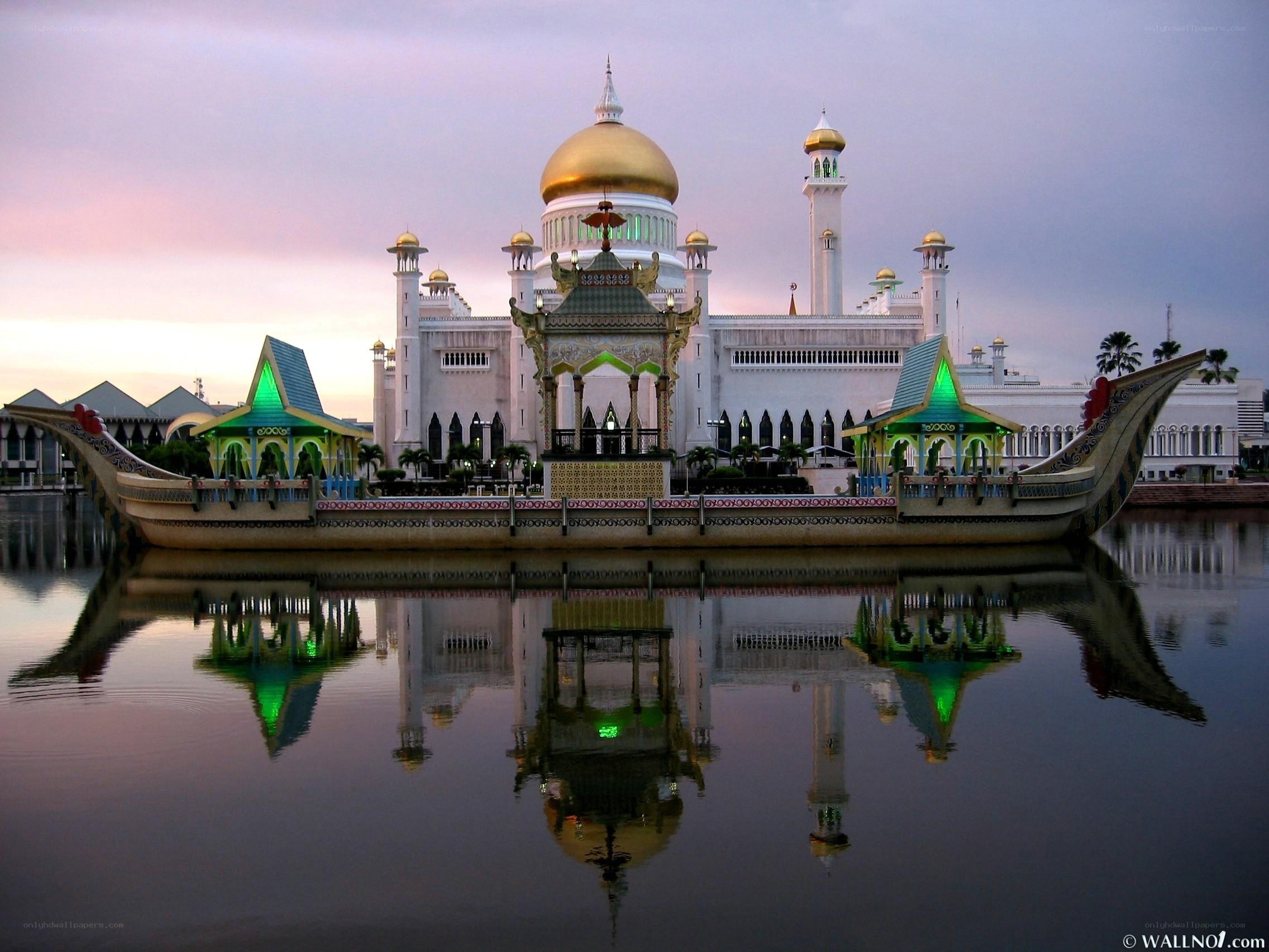White mosque with golden dome