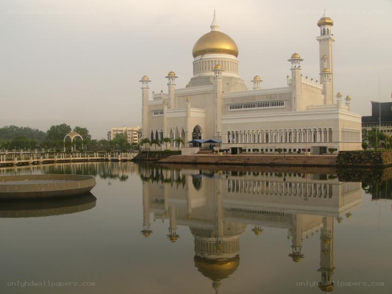 White mosque with golden dome
