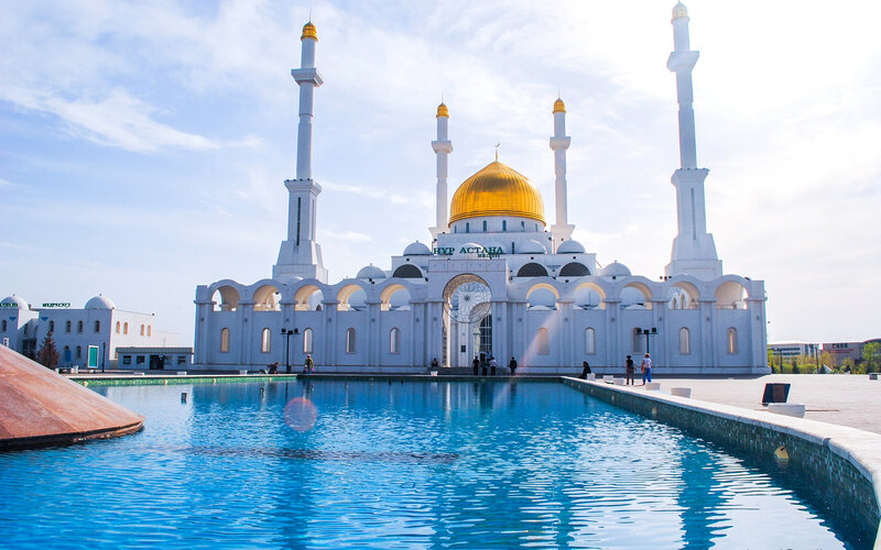 White mosque with golden dome