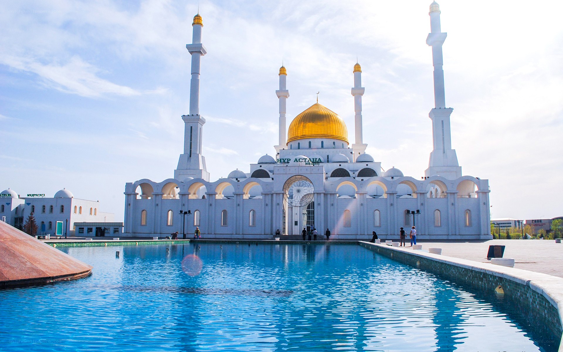 White mosque with golden dome