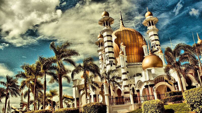 White mosque with golden domes