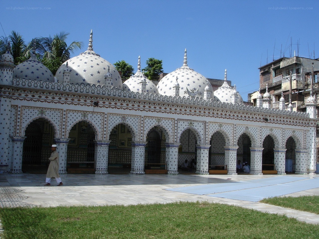 White mosque with star-decorated domes