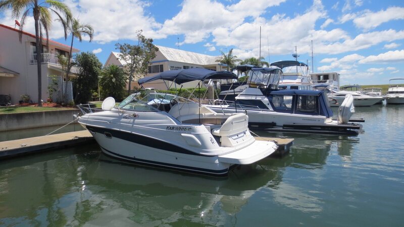 White Motorboat in Marina — Blue