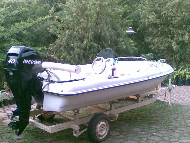 White Motorboat on Trailer